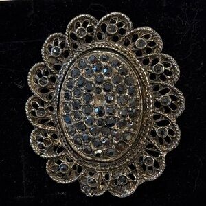 Elegant Silver Brooch with Black Accents